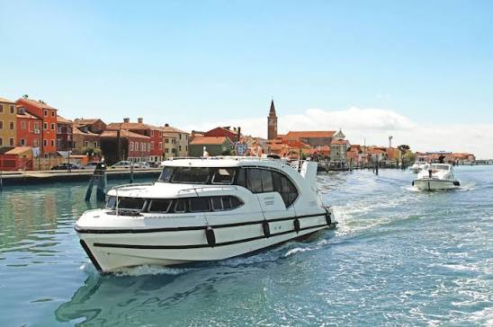 Yacht maintenance workshop with tools and marine equipment